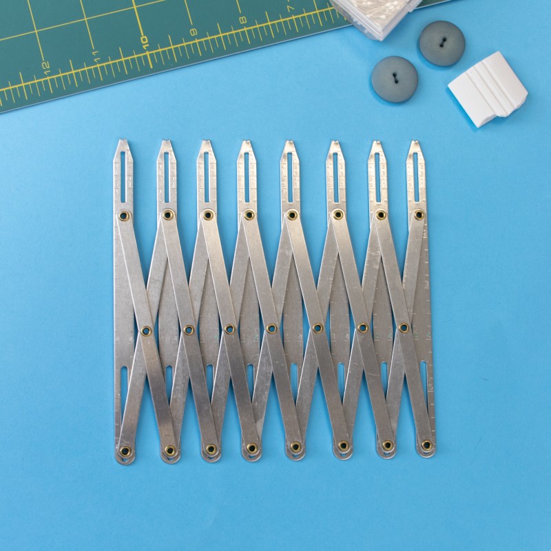 règle boutonnière métal